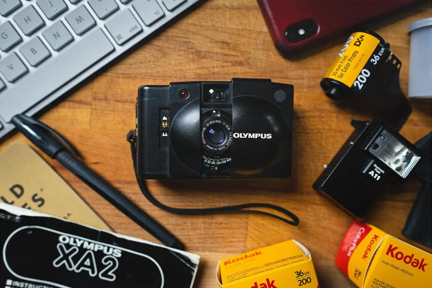 An Olympus XA2 point and shoot 35mm film camera.