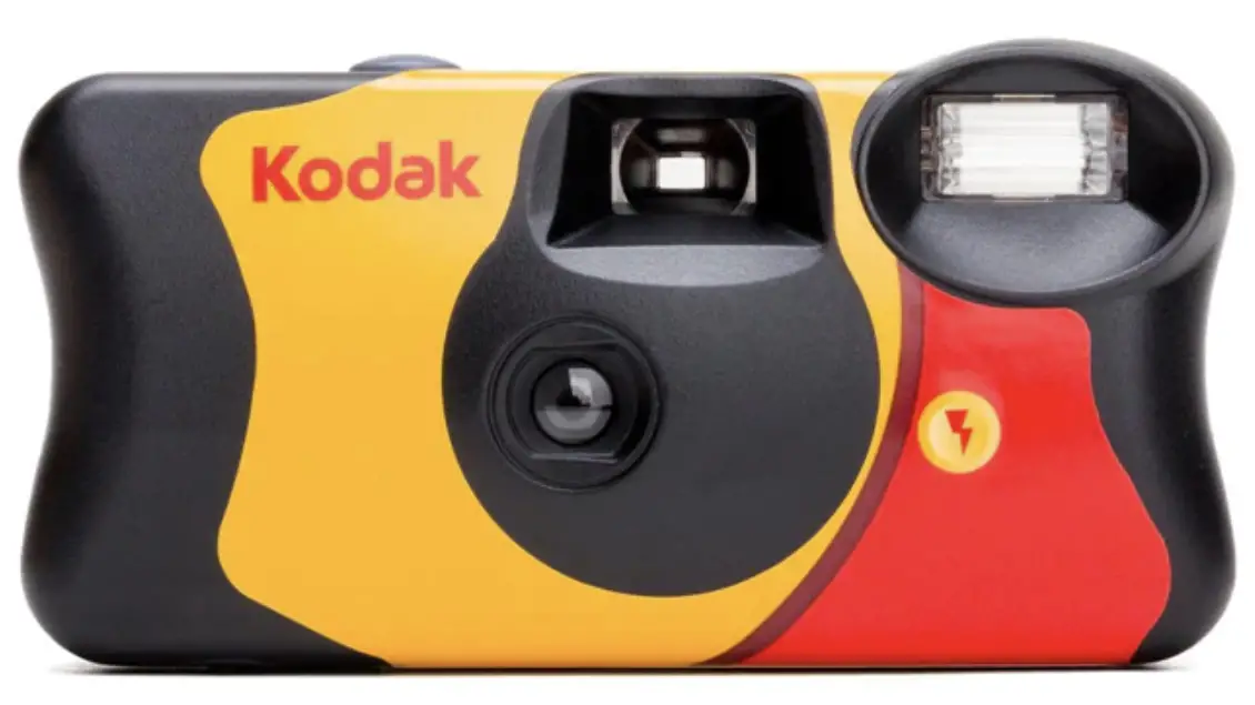 The Front of a Kodak disposable or single-use camera. Note the button to push (the lightening bolt) to turn on and off and to charge the camera flash.