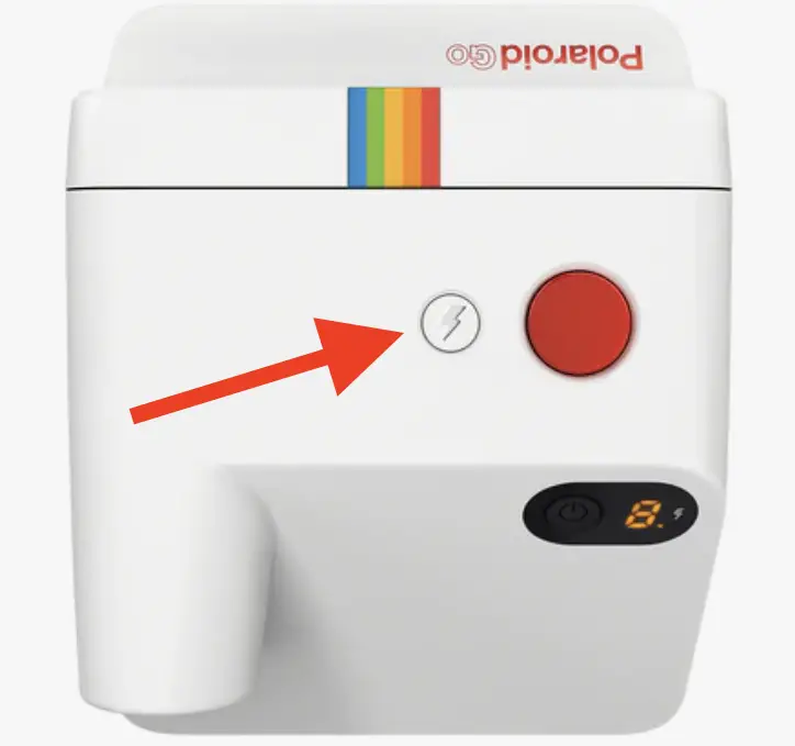 The flash / self-timer / double exposure button located on the top of the Polaroid Go next to the red shutter button.