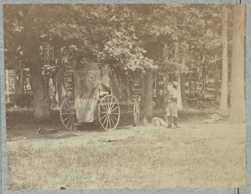 Timothy O'Sullivan. Photographed 1862, [printed between 1880 and 1889] Photograph shows a portable photographer's darkroom on wheels and possibly Timothy O'Sullivan standing next to it. (Source: Stereograph of similar image at the New York Historical Society). Brady's portable darkrooms were nicknamed "Whattizit" by the troops. (Source: Field, Ron. Silent Witness, 2017, page 173)