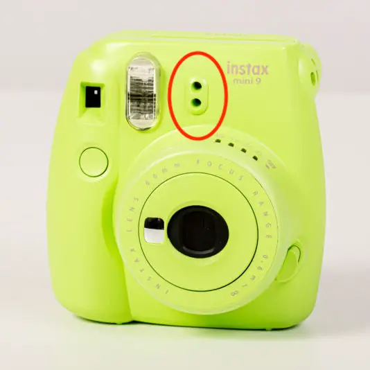 The two small holes on the Instax Mini 9 that calculates exposure