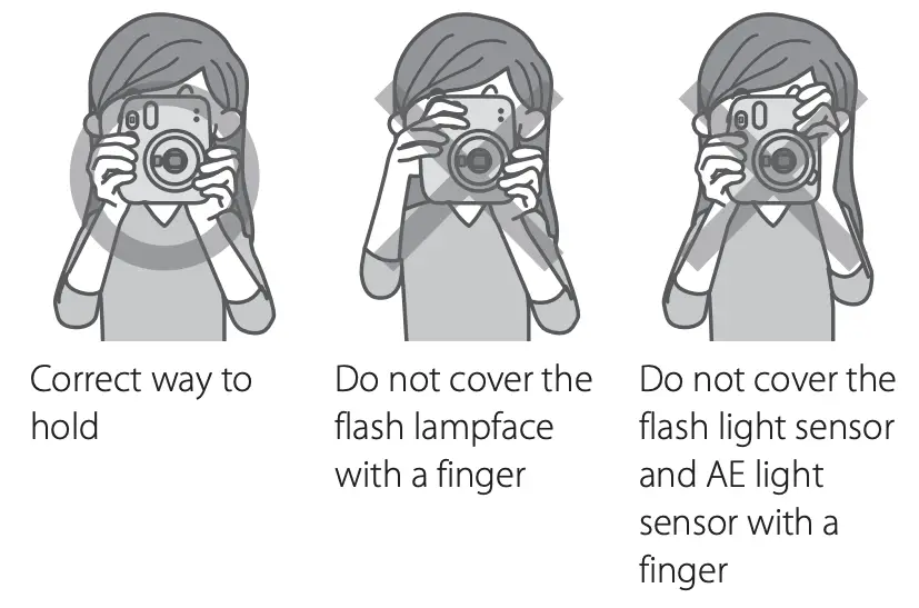 Don't cover the flash or the light sensor holes on the front of the Instax Mini 11 when taking images | Fujifilm