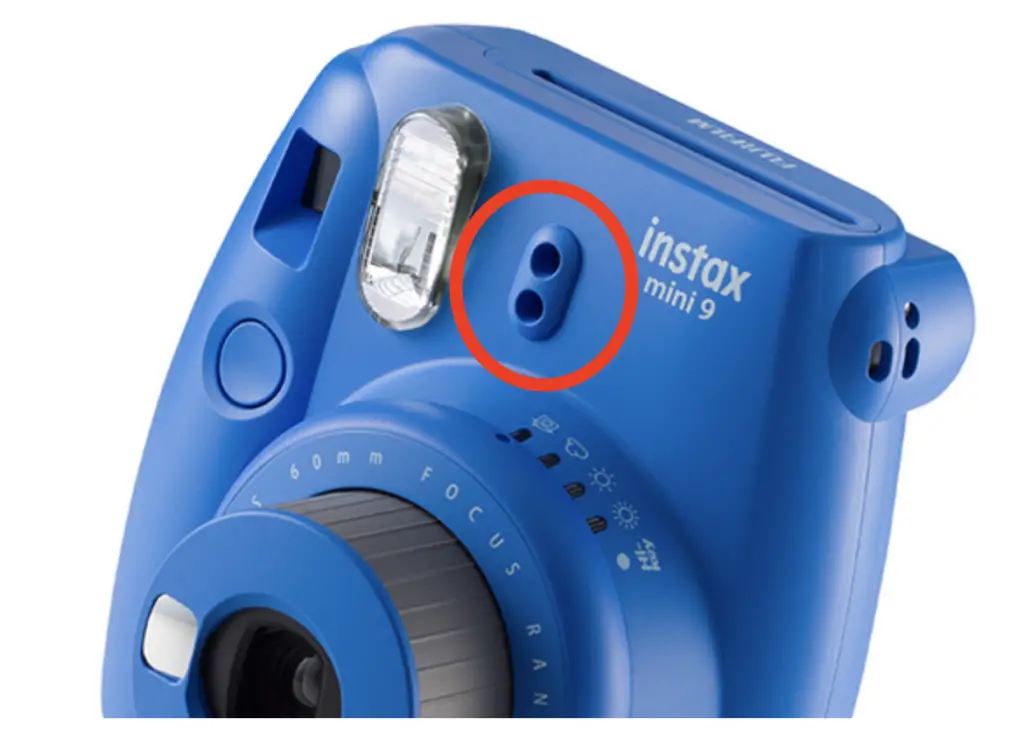 The light sensors on the front of the Instax Mini 9 camera. 