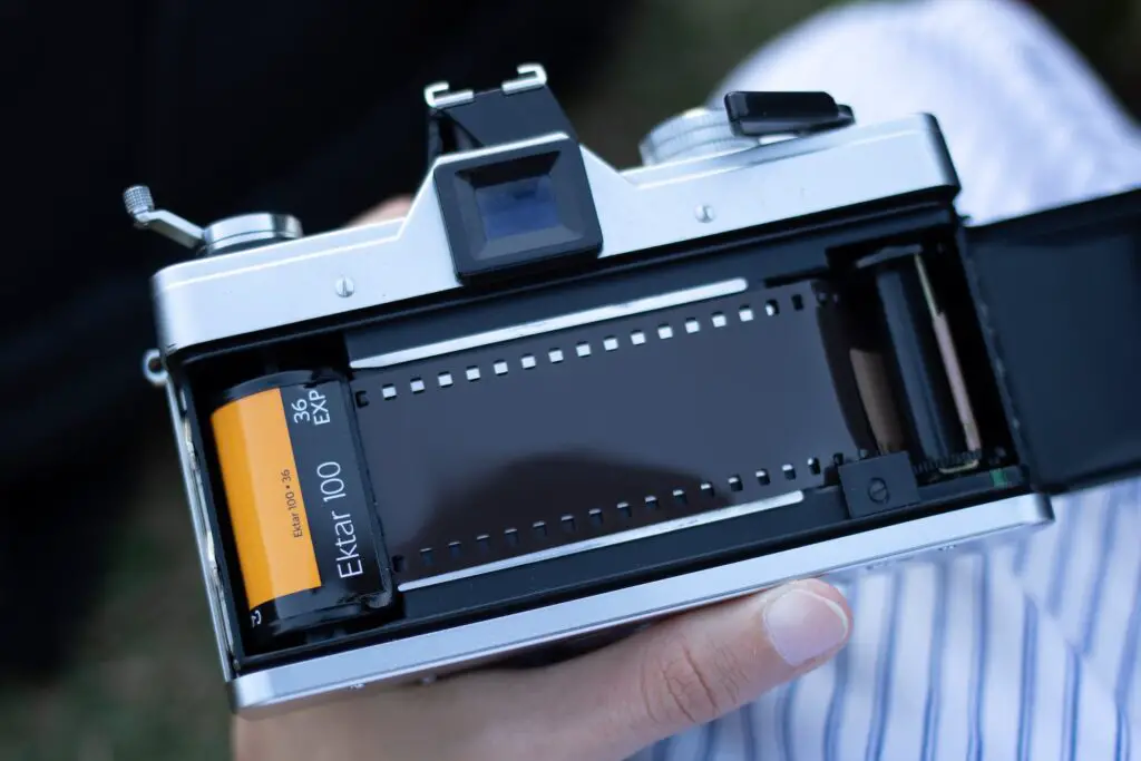 35mm Film Properly Loaded Into the Back of A Film Camera With Part of the Film Leader Exposed